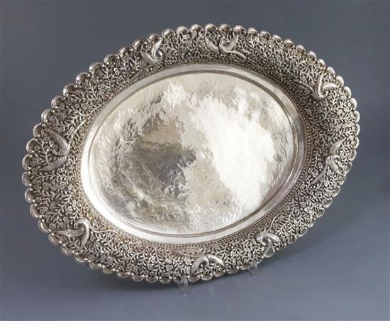 An early 20th century Indian planished silver oval fruit bowl, 24 oz.